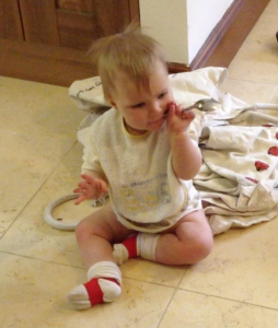Most articles about babies and potties show a picture of the baby on a potty, but I find Zoe prefers her privacy (walking out of the room is a fairly sure-fire way of getting her to pee!). So here's another picture of her without a nappy on.