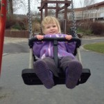 Zoe at 20 months, on a swing